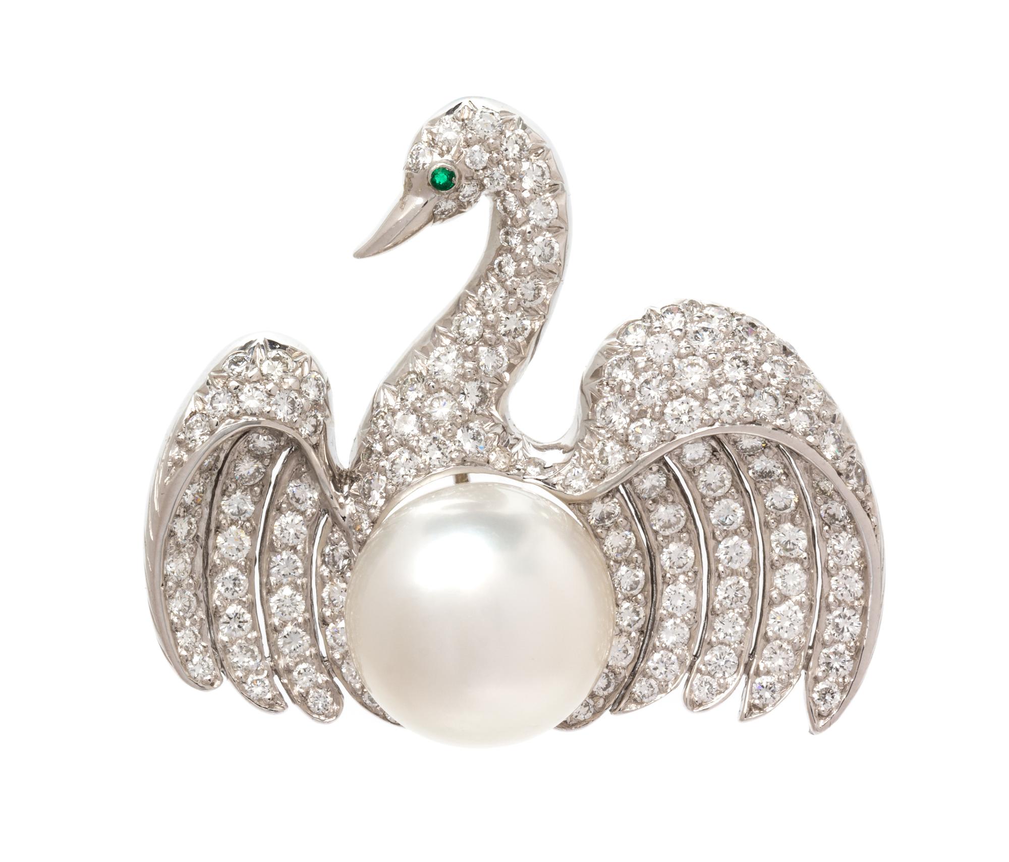 A Platinum, Cultured South Sea Pearl, Diamond and Emerald Swan Brooch, 11.55 dwts.