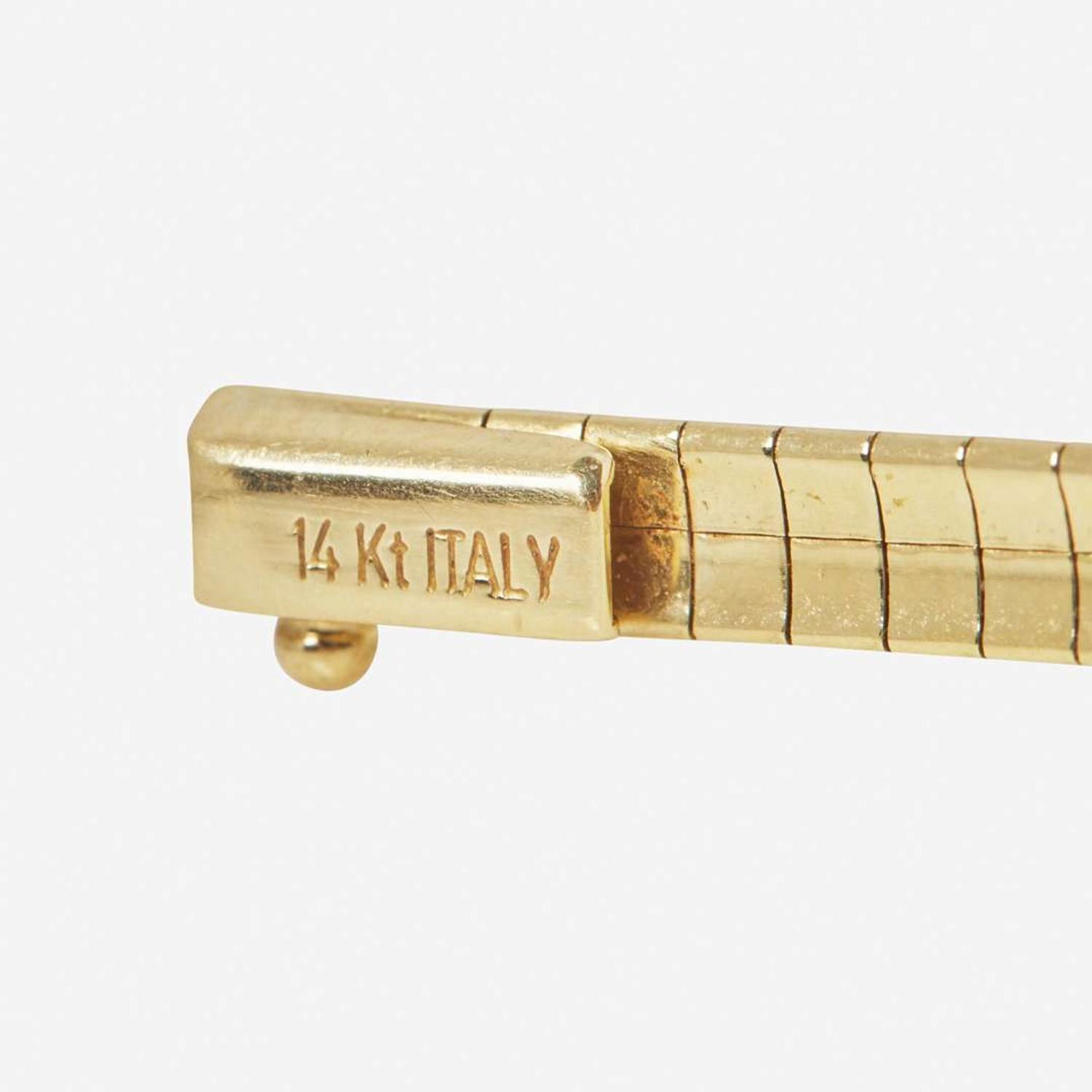 A 14K Yellow Gold Omega Chain and Slider Charms
