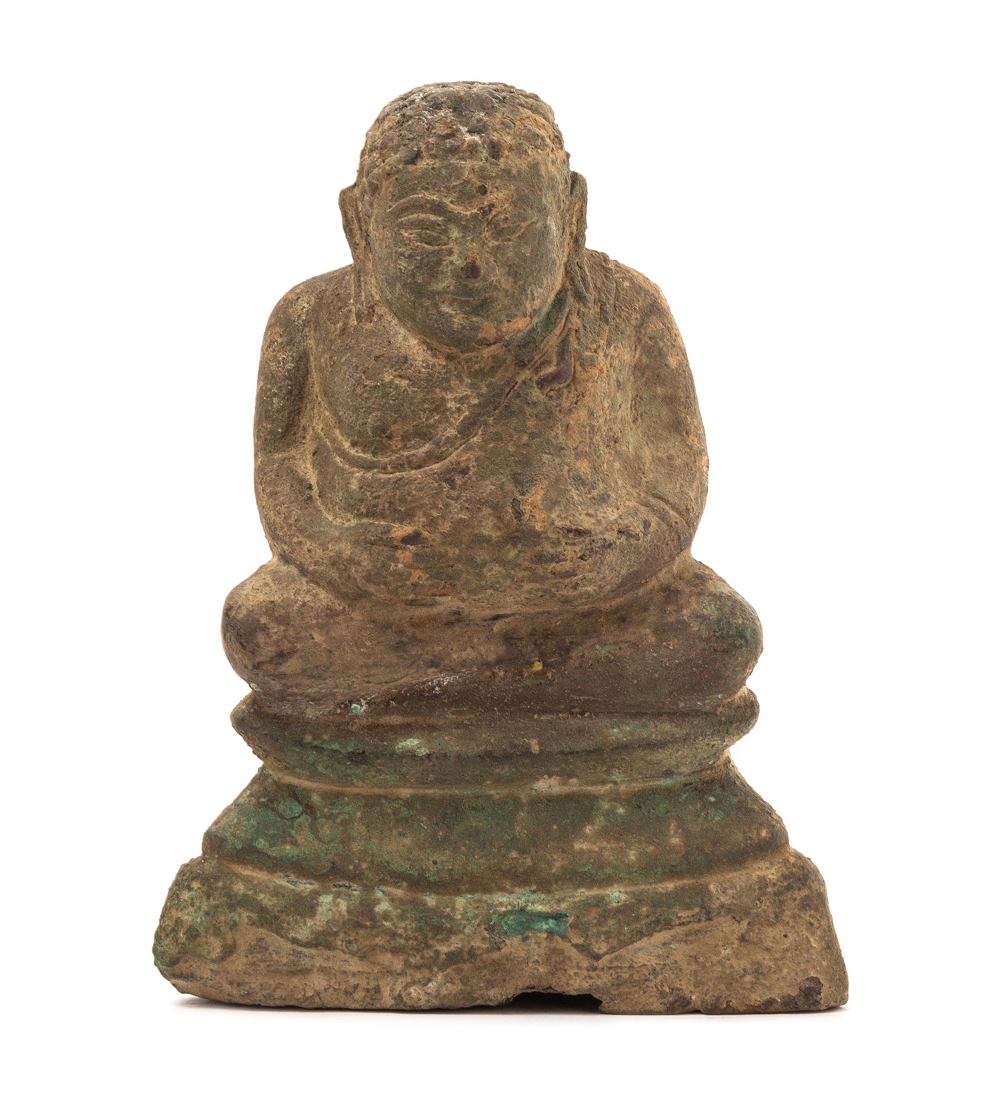 A Thai Bronze Figure of the Buddhist Disciple, Phra Sankachai 17TH CENTURY OR EARLIER Height 6 1/2 x width 5 inches. — 17TH CENTURY OR EARLIER