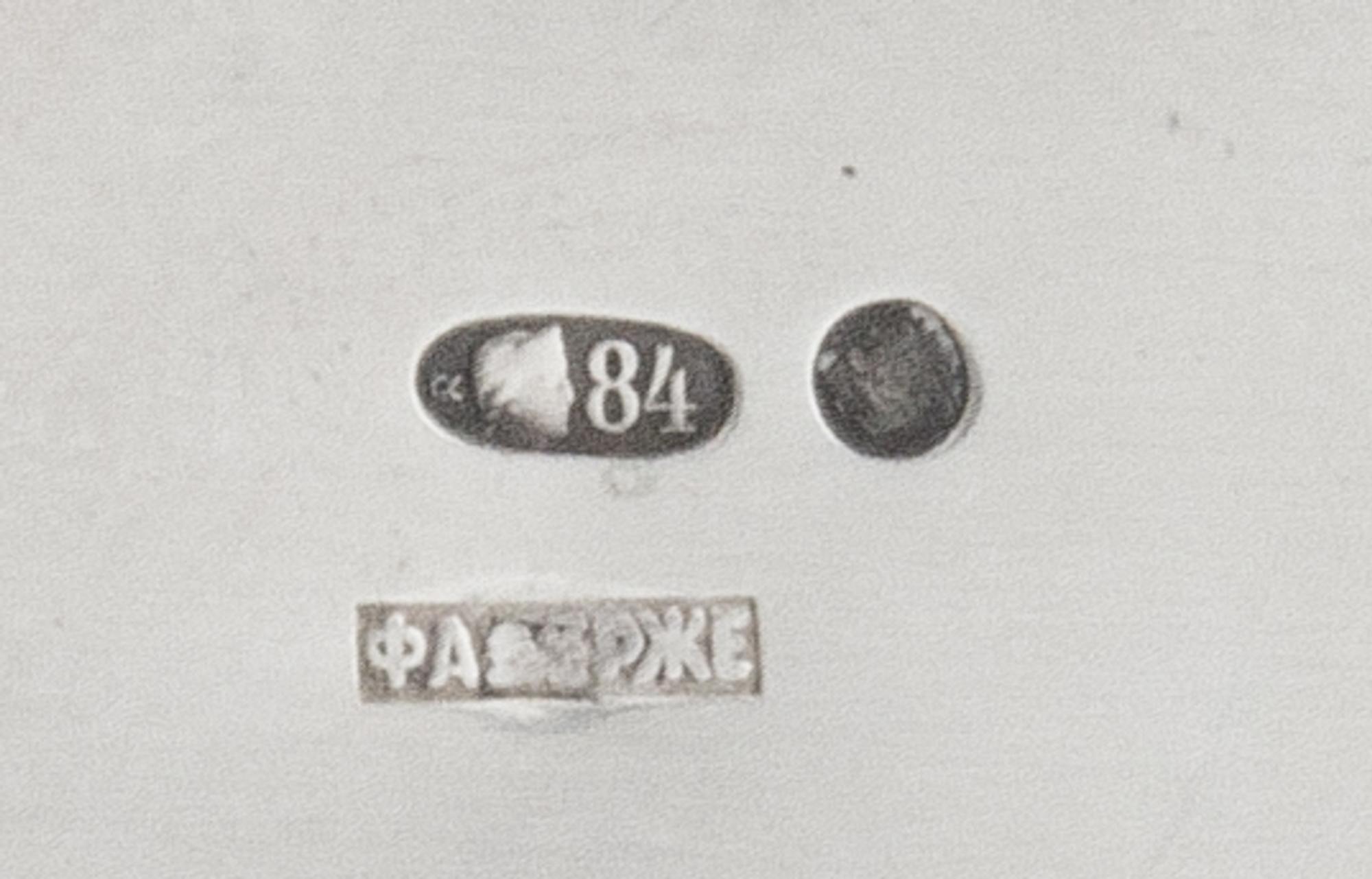 A Russian Silver Kovsh, Spurious Mark of Faberge, St. Petersburg, 20th Century, the rim with a foliate band, the handle inset with a 17