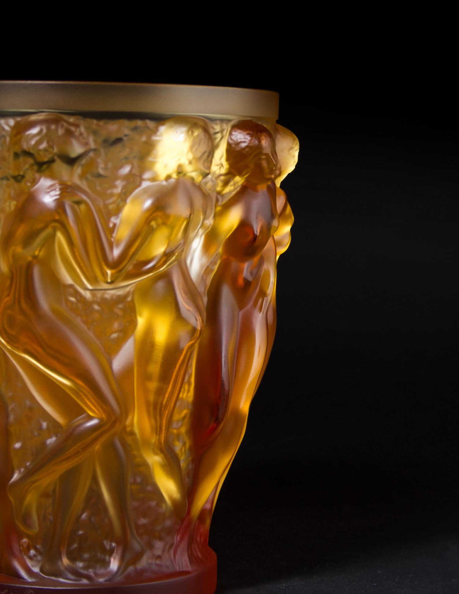 A Lalique Molded and Frosted Amber Glass Vase, Height 9 5/8 inches.
