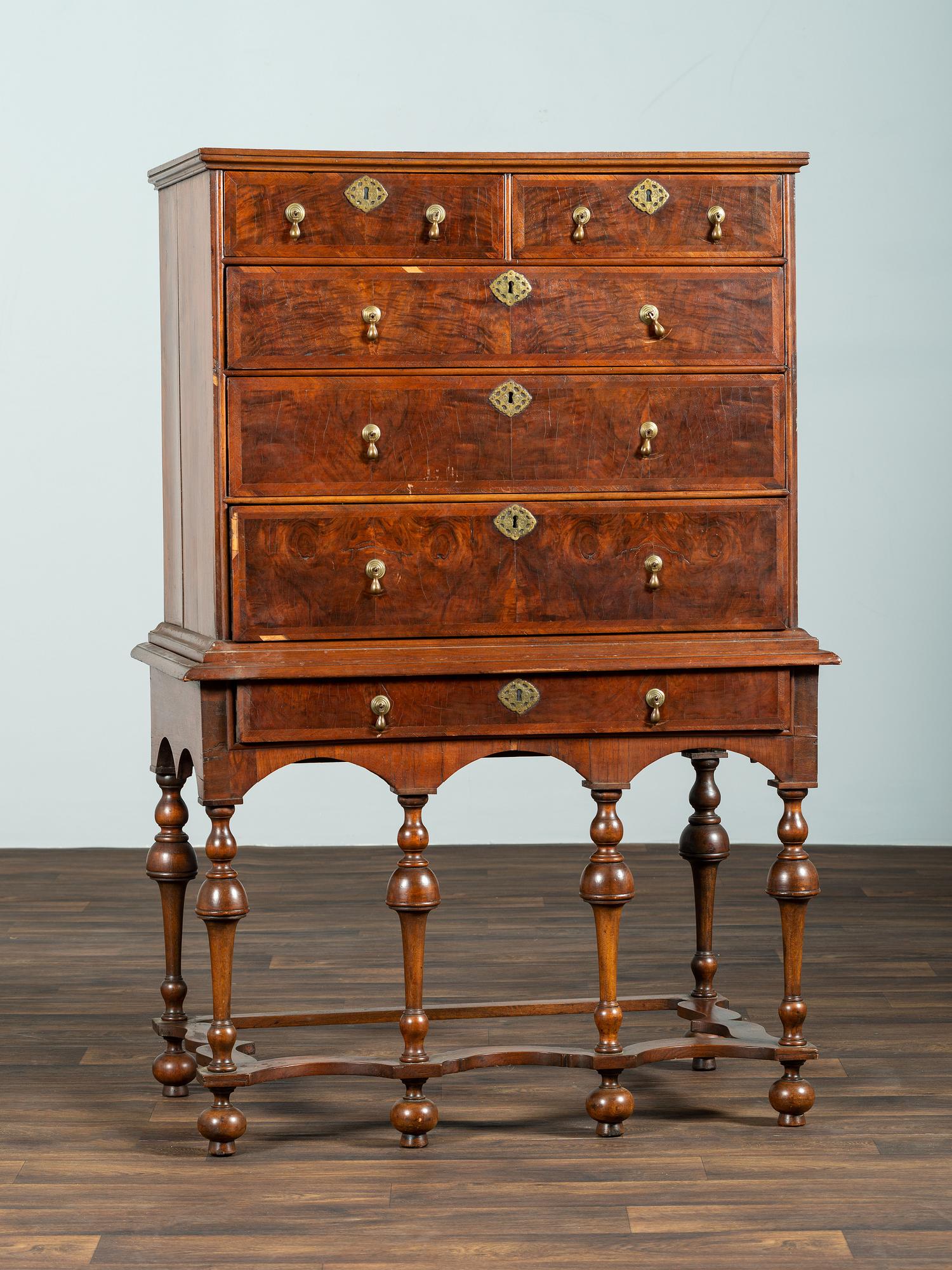 A William and Mary Maple and Feather-Banded Walnut Veneered Flat-Top High Chest