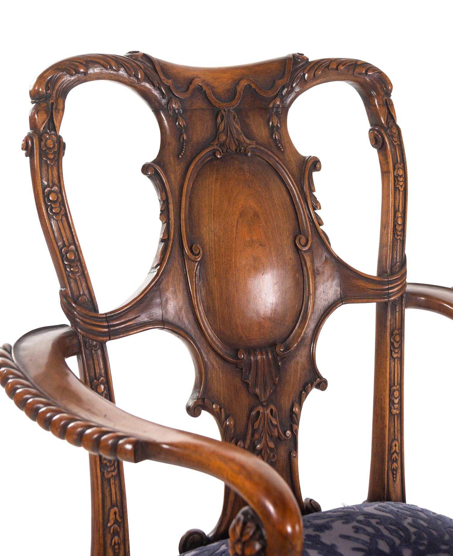 An Irish George I Style Carved Walnut Armchair