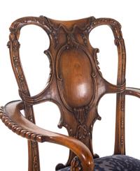 An Irish George I Style Carved Walnut Armchair
