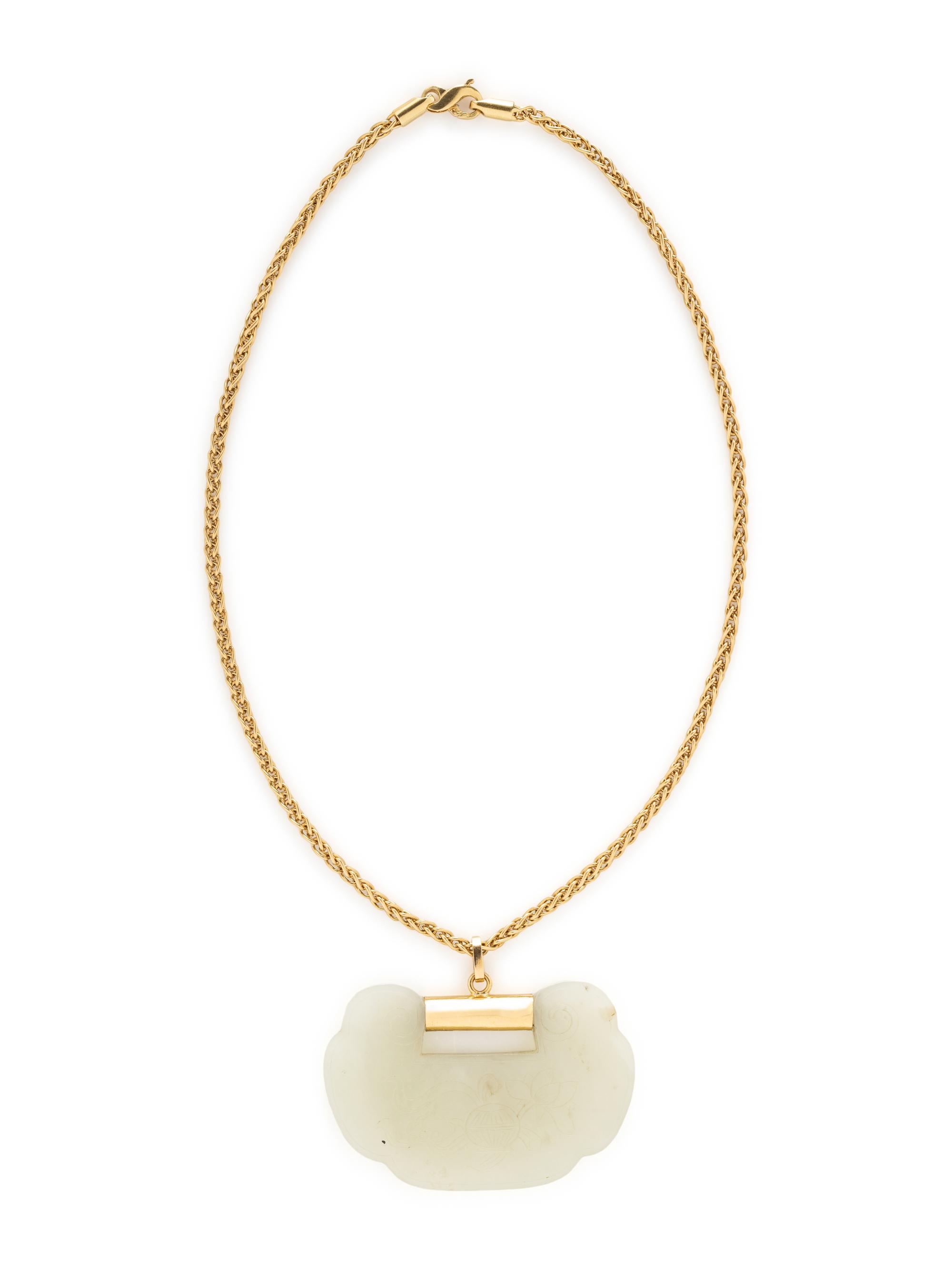 YELLOW GOLD AND CARVED JADE NECKLACE