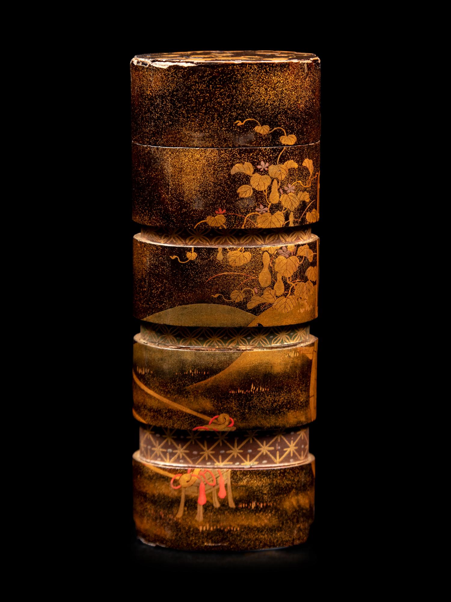 A Gold and Black Lacquer Four-Case Inro