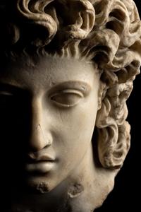 A Roman Marble Head of a Triton