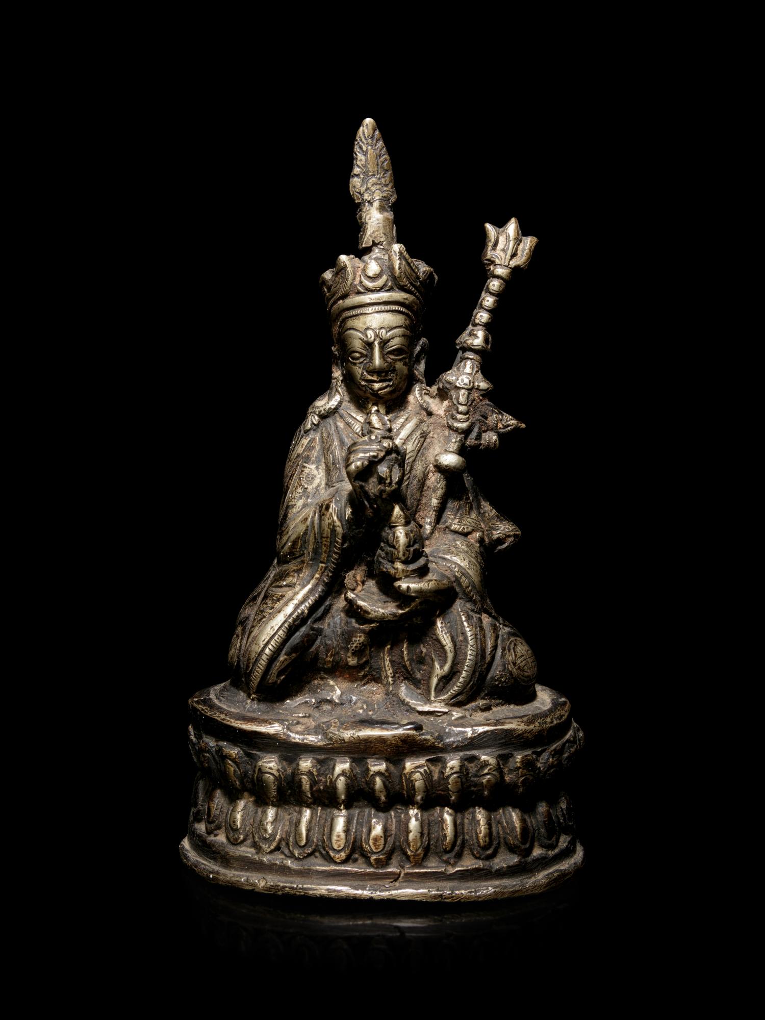 A Sino-Tibetan Silvered Metal Figure of Padmasambhava