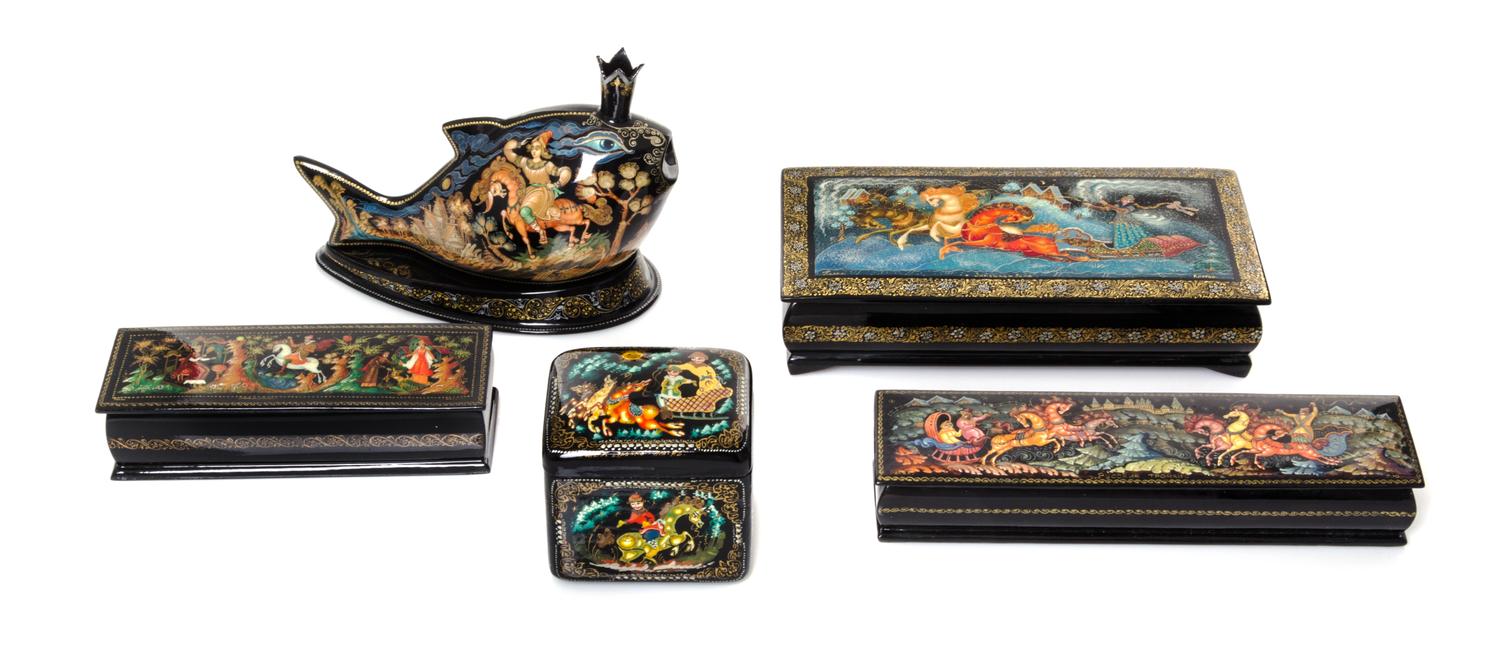 A Collection of Five Russian Lacquered Boxes, 20th Century, of various forms and sizes, each decorated with traditional figures on hors