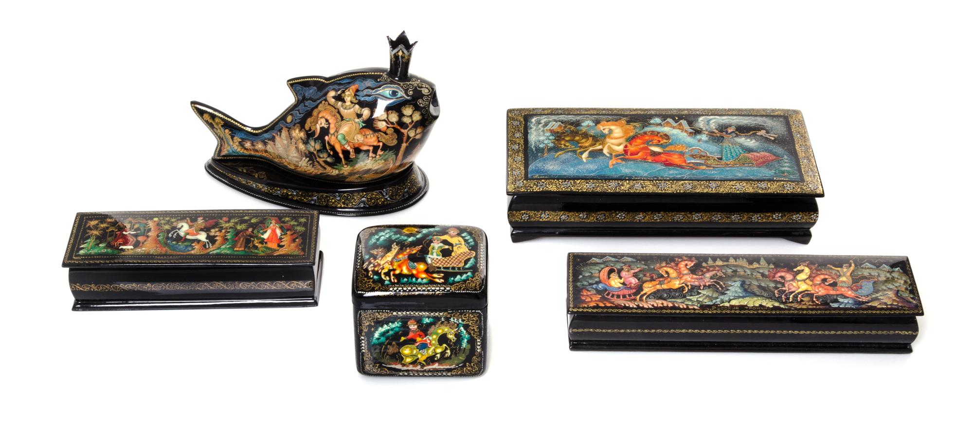 A Collection of Five Russian Lacquered Boxes, 20th Century, of various forms and sizes, each decorated with traditional figures on hors