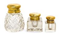 A Group of Three Brass Mounted Glass Inkwells Height of tallest 4 3/8 inches.
