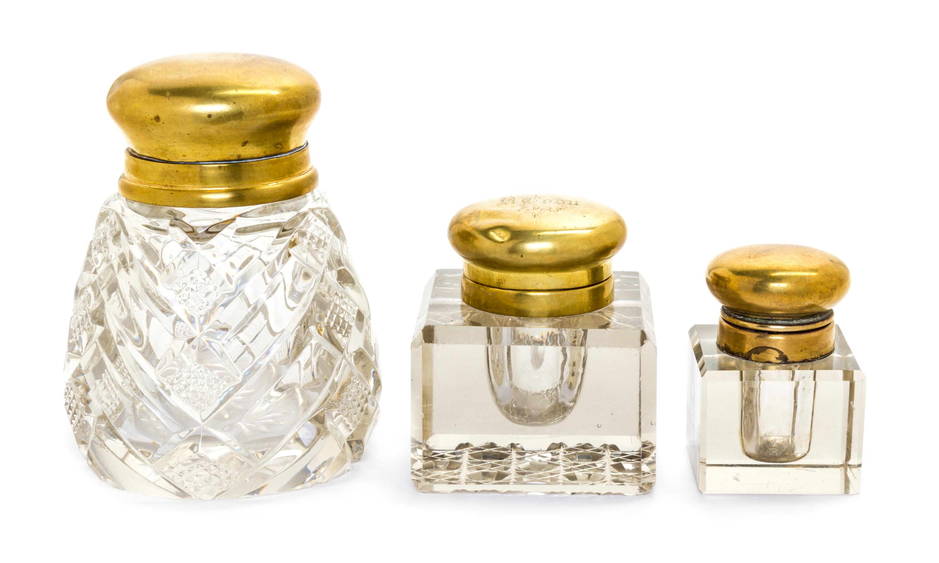 A Group of Three Brass Mounted Glass Inkwells Height of tallest 4 3/8 inches.