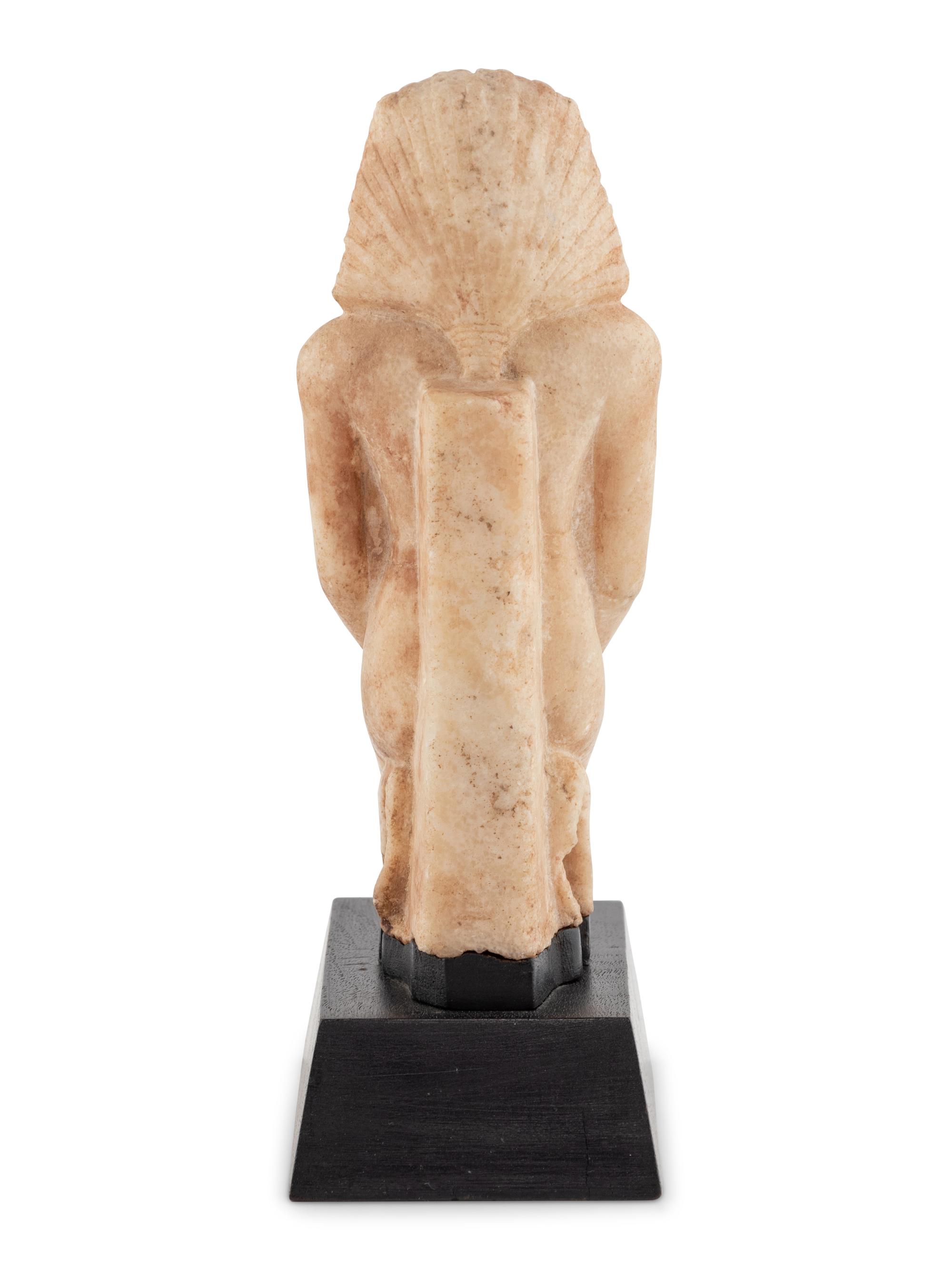 A White Stone Figure of a Kneeling Pharaoh
