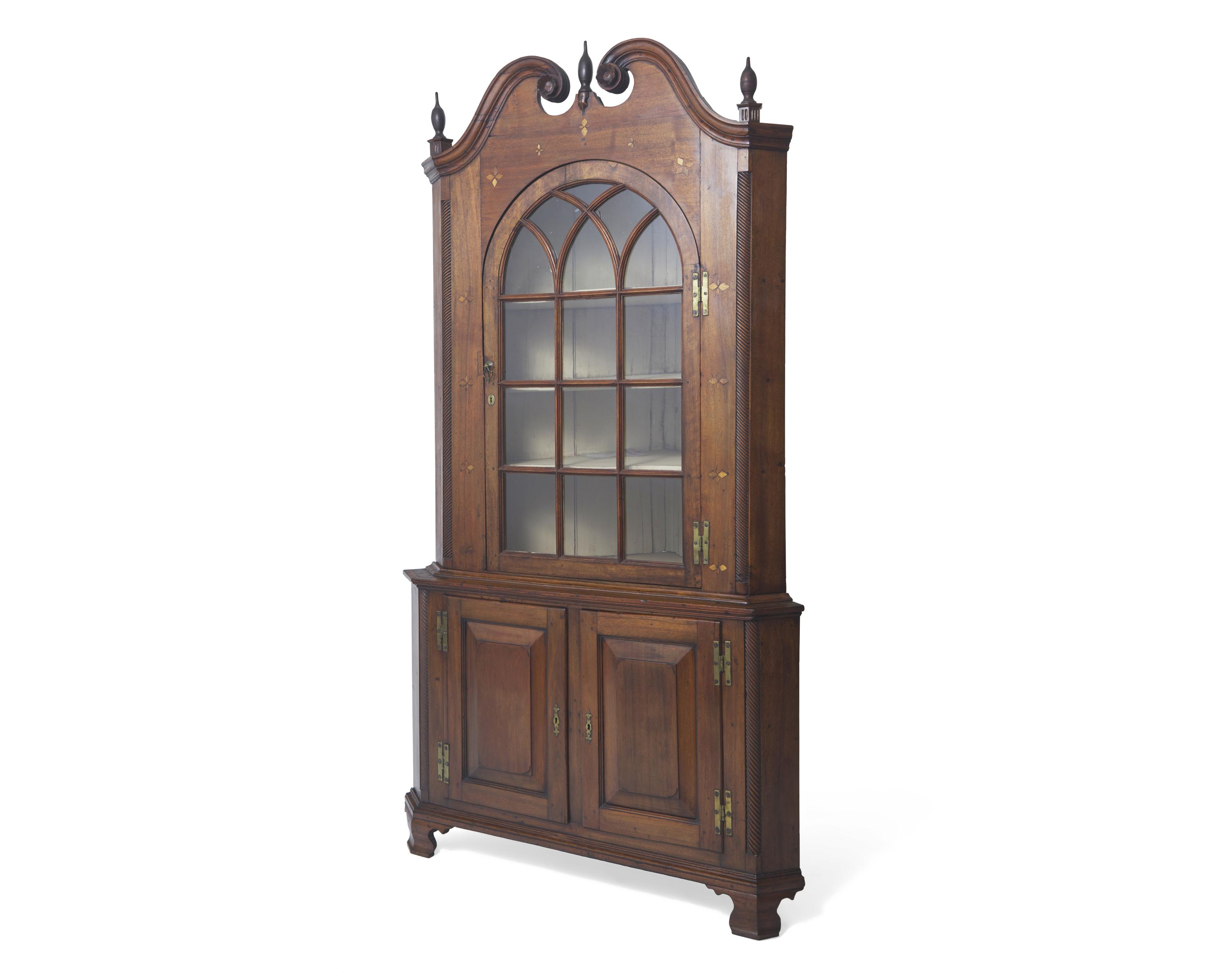 A Chippendale Inlaid Walnut Corner Cupboard, Pennsylvania, Late 18th Century