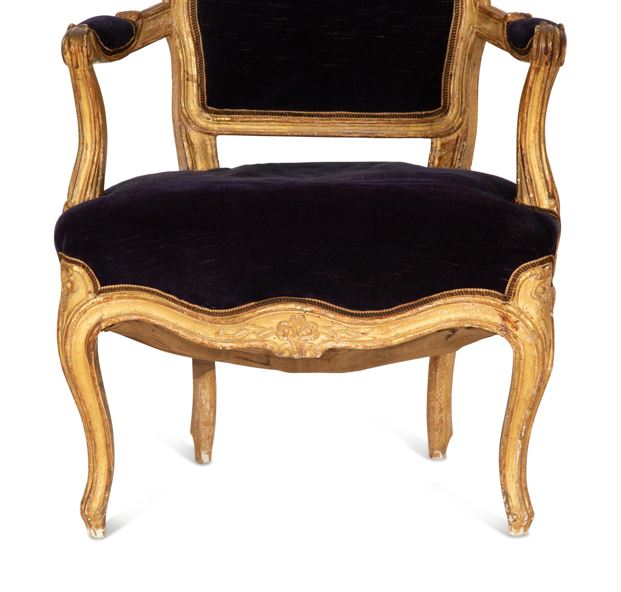 A Pair of Louis XV Giltwood Fauteuils