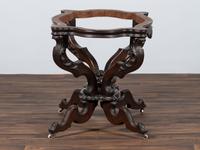 A Renaissance Revival Carved Walnut Marble Top Center Table