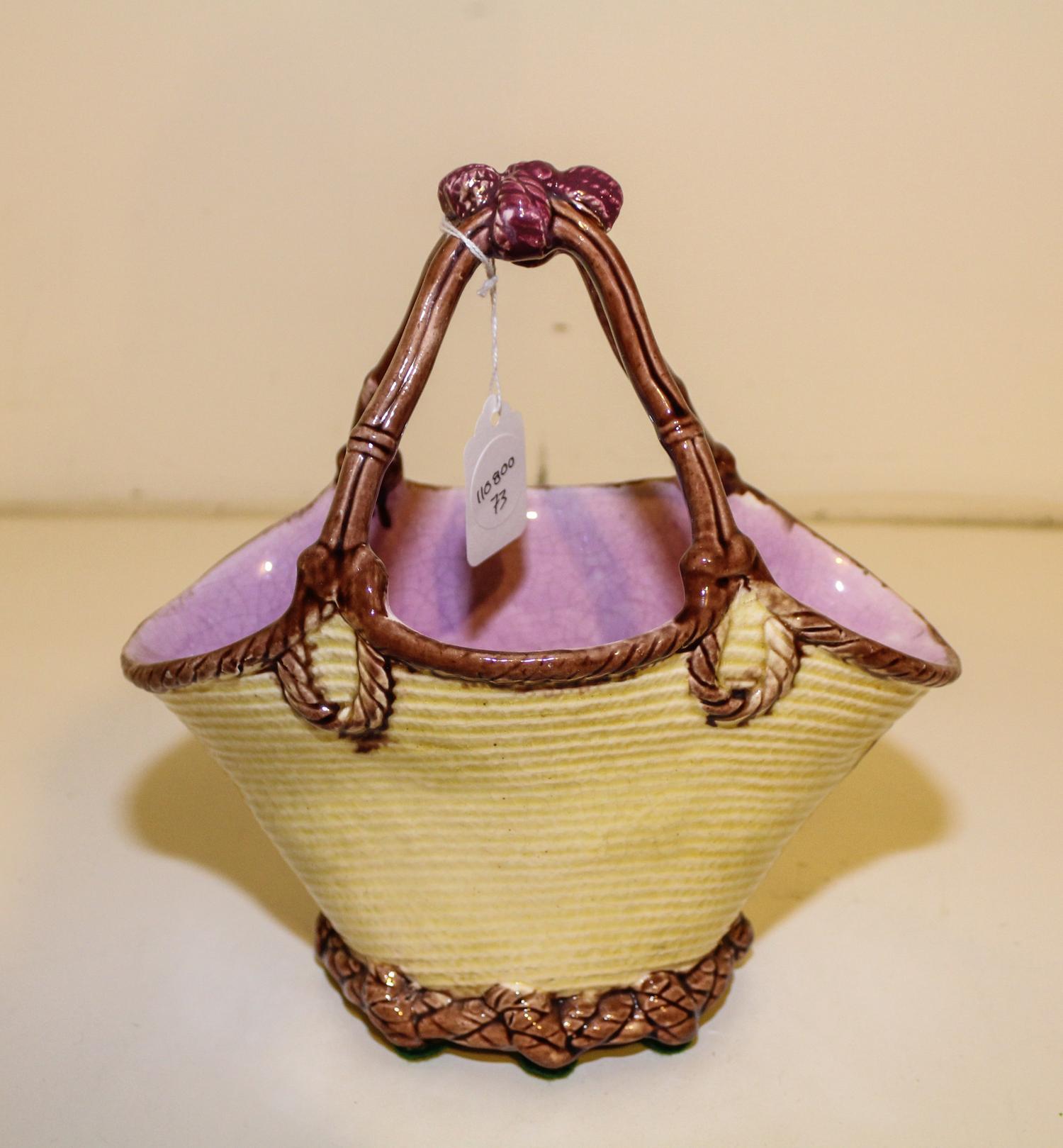 A Majolica Basket. Height 9 1/4 inches.