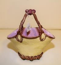 A Majolica Basket. Height 9 1/4 inches.