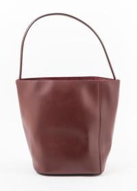 A Cartier Burgundy Calfskin Must-C Bucket Bag, 8" x 11" x 7.5"; Handle drop: 9".