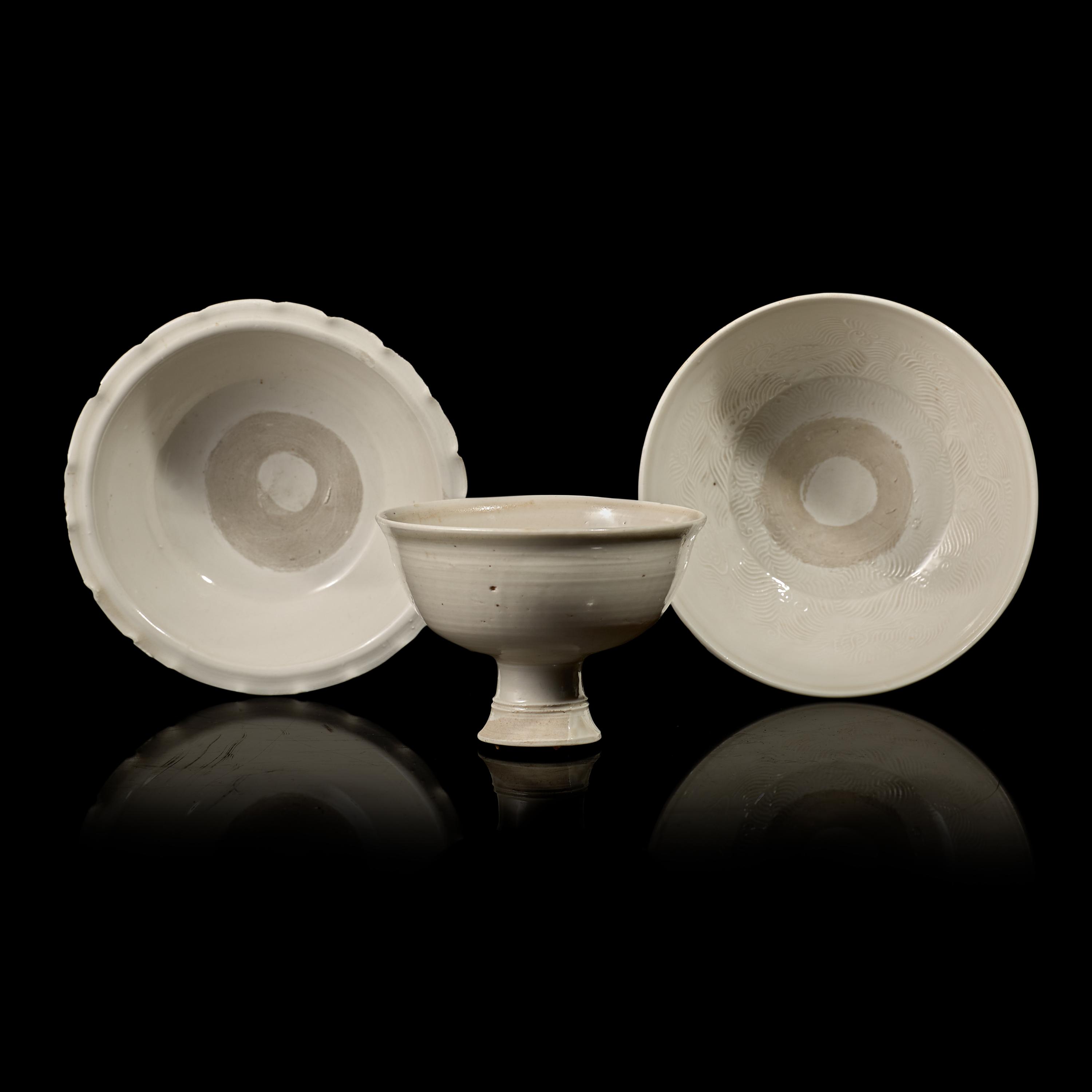 Two Chinese Huozhou White Glazed Bowls and a Stem Cup, Song Dynasty 宋 霍州窯白釉瓷碗二及高足杯一