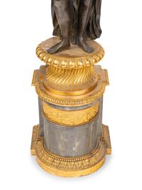 A Pair of Louis XVI Gilt and Patinated Bronze Four-Light Candelabra