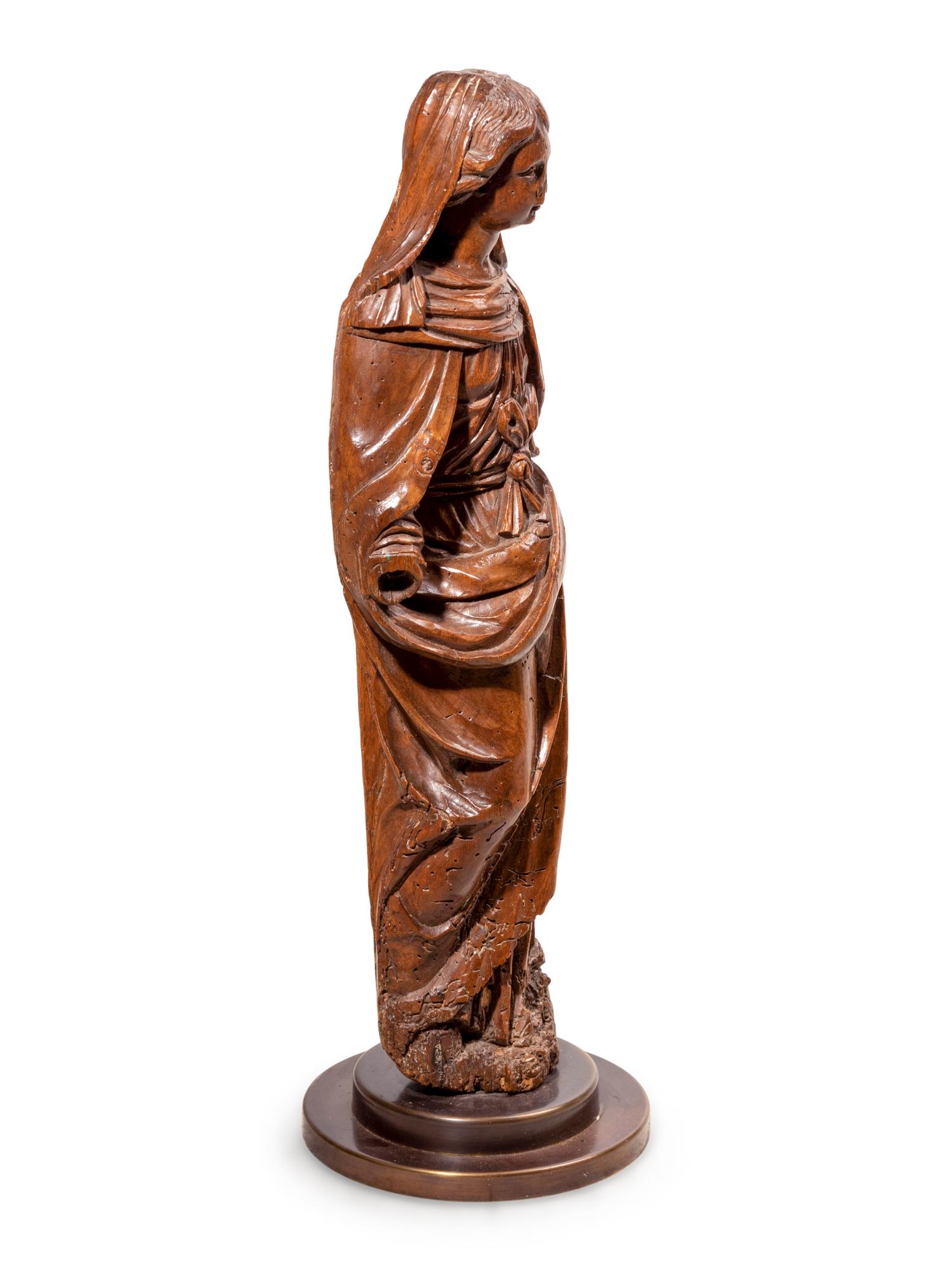 A Continental Carved Walnut Figure of the Virgin Mary
