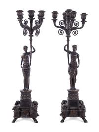 A Pair of Empire Style Silvered Metal Figural Five-Light Candelabra
