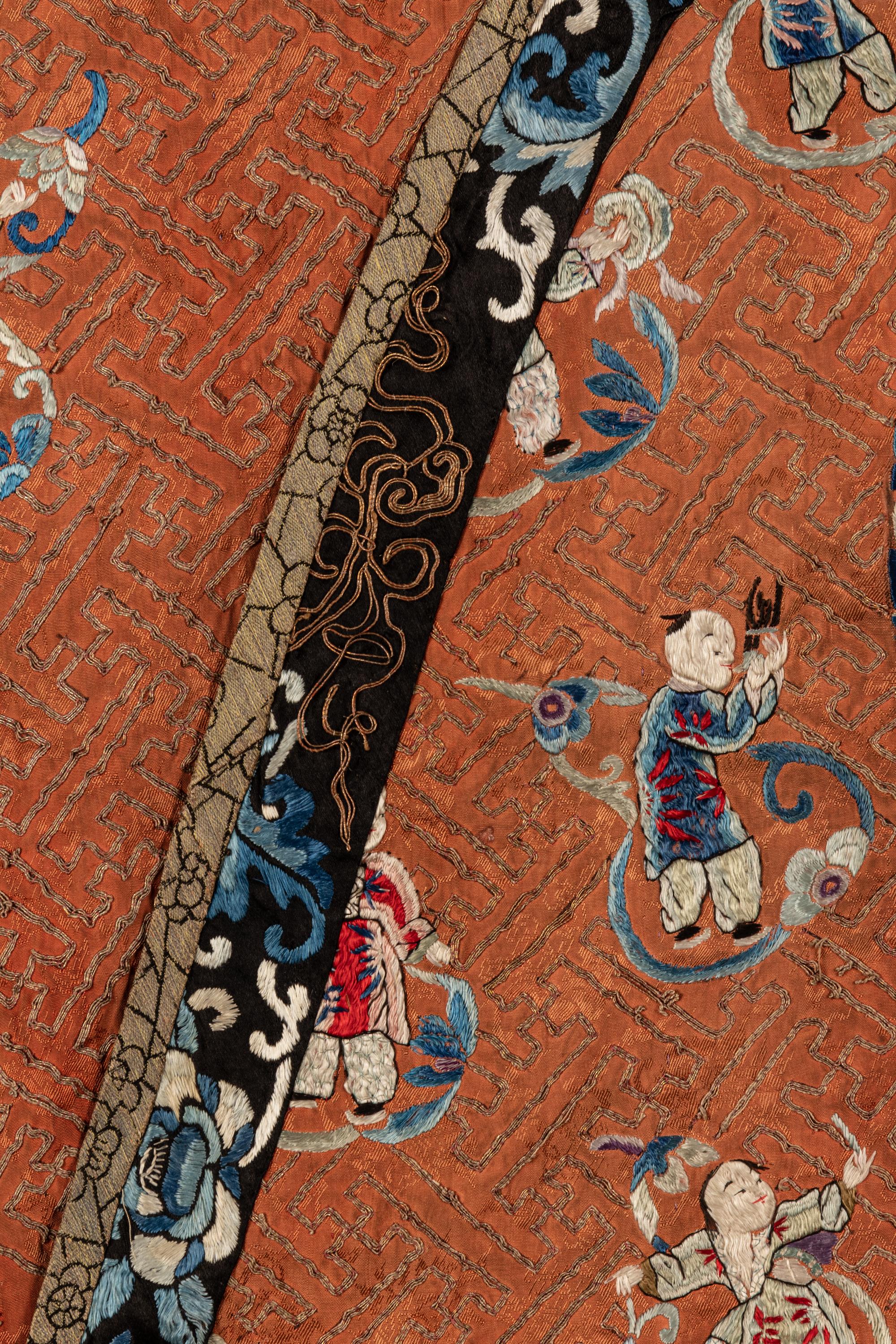 An Apricot Ground Embroidered Silk Lady’s Informal Robe
