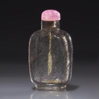 A Chinese "Hair Crystal" Snuff Bottle, Qing Dynasty, Circa 1740-1850 — 1740–1850年 髮晶素面鼻煙壺