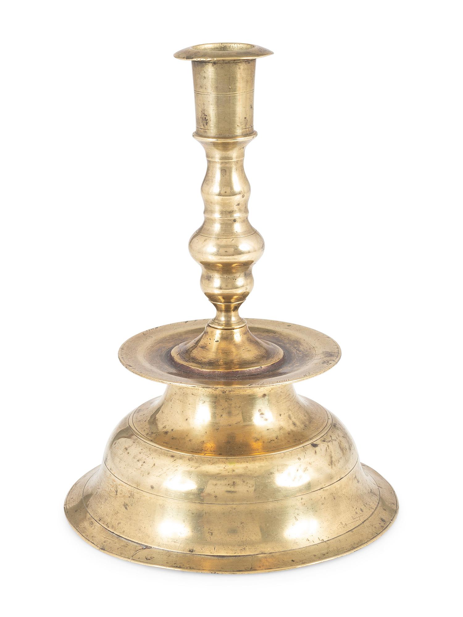 A Continental Brass Heemskirk Bell-Bottom Candlestick