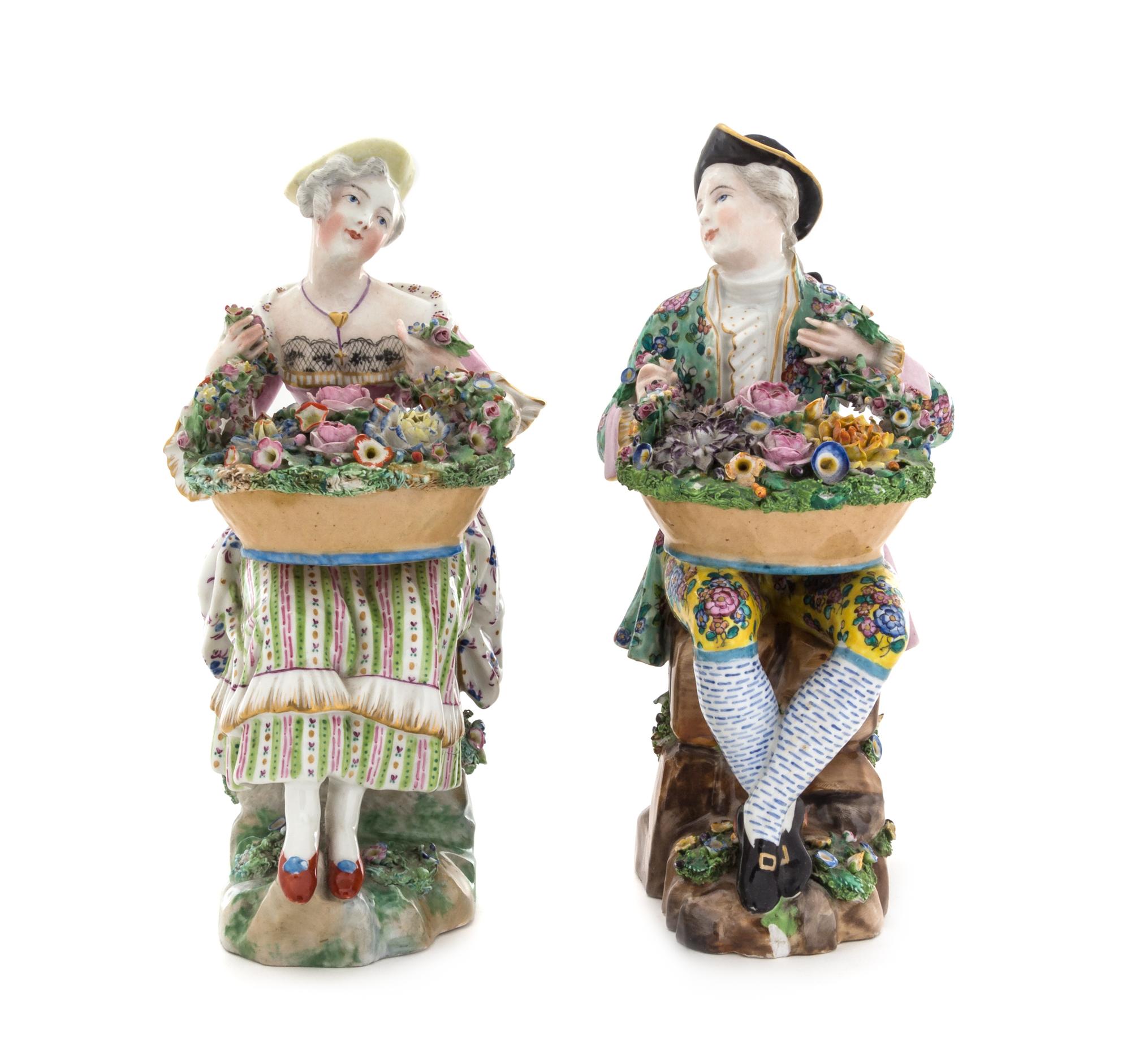 A Pair of Continental Porcelain Figures Height of tallest 9 1/2 inches. — 19TH CENTURY