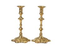 A Group of Four George III Brass Candlesticks