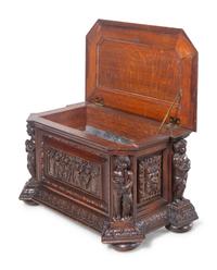 A Renaissance Revival Carved Oak Cellarette