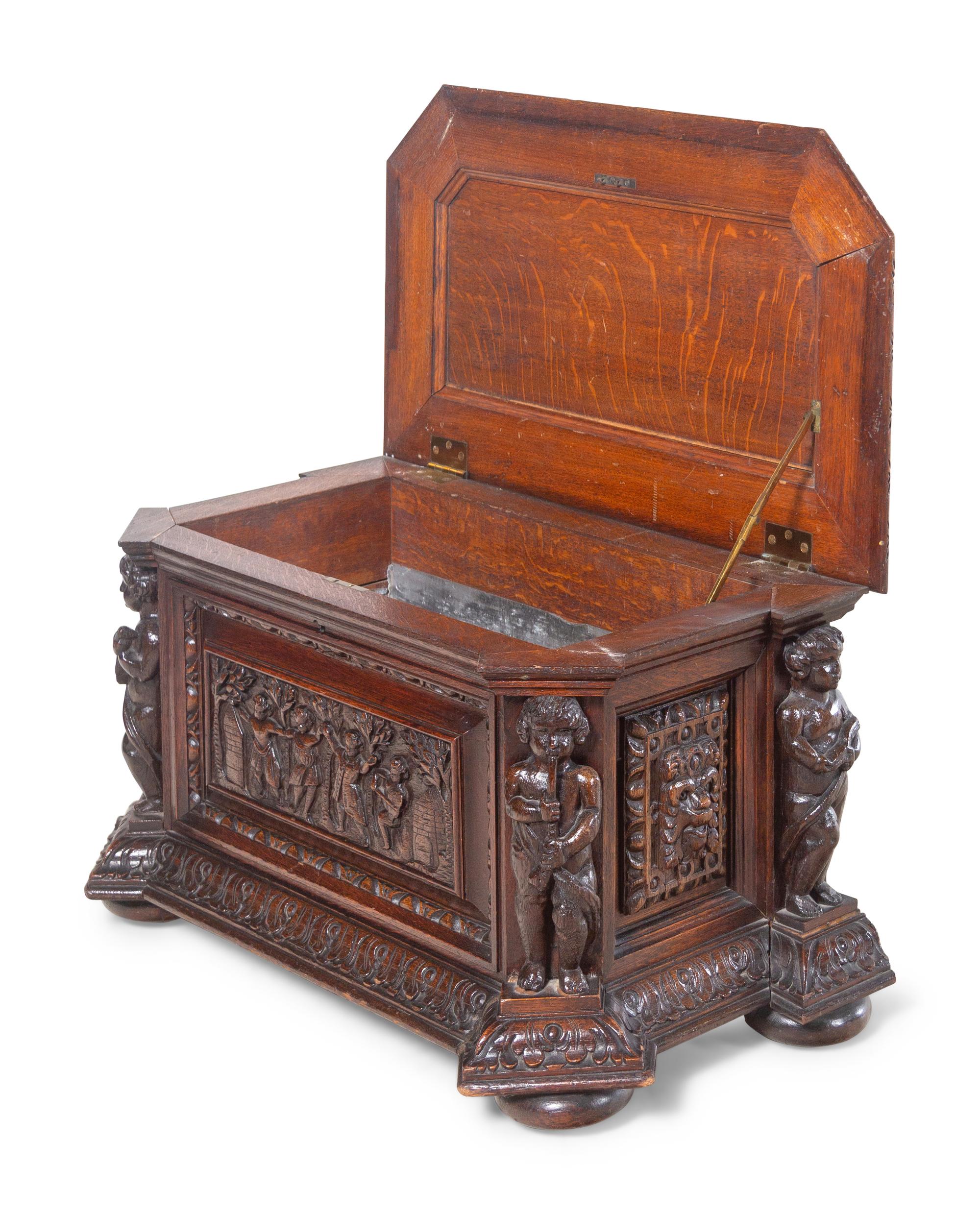 A Renaissance Revival Carved Oak Cellarette