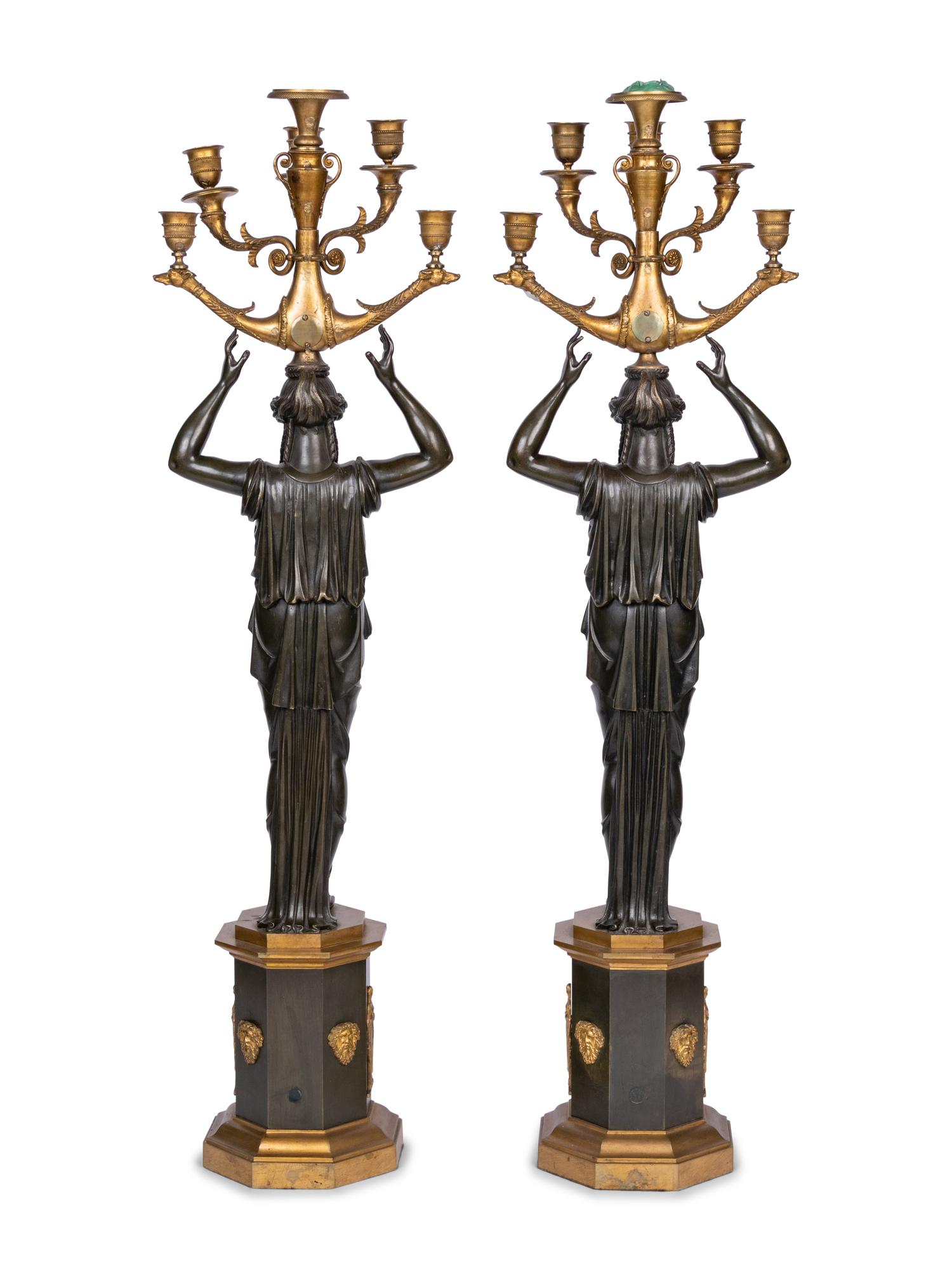 A Pair of Empire Style Gilt and Patinated Bronze Six-Light Figural Candelabra