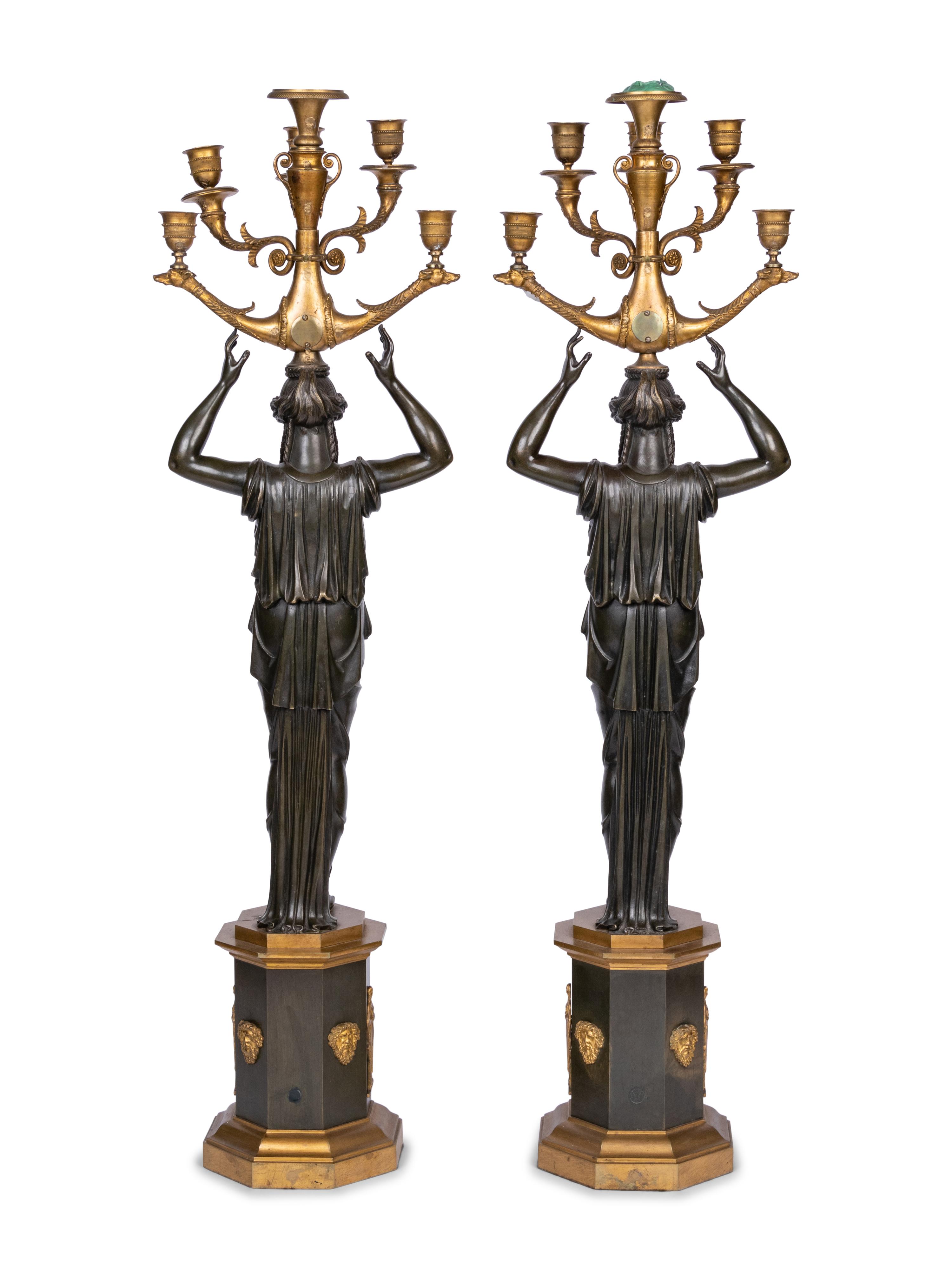 A Pair of Empire Style Gilt and Patinated Bronze Six-Light Figural Candelabra