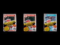 A Collection of Unopened 1985 Fleer Baseball Card Cello Packs with Kirby Puckett and Roger Clemens Rookie Cards Visible (x3)