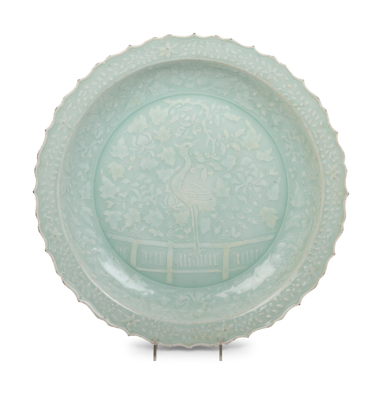 A Chinese Molded Celadon Glazed Porcelain Charger