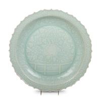 A Chinese Molded Celadon Glazed Porcelain Charger