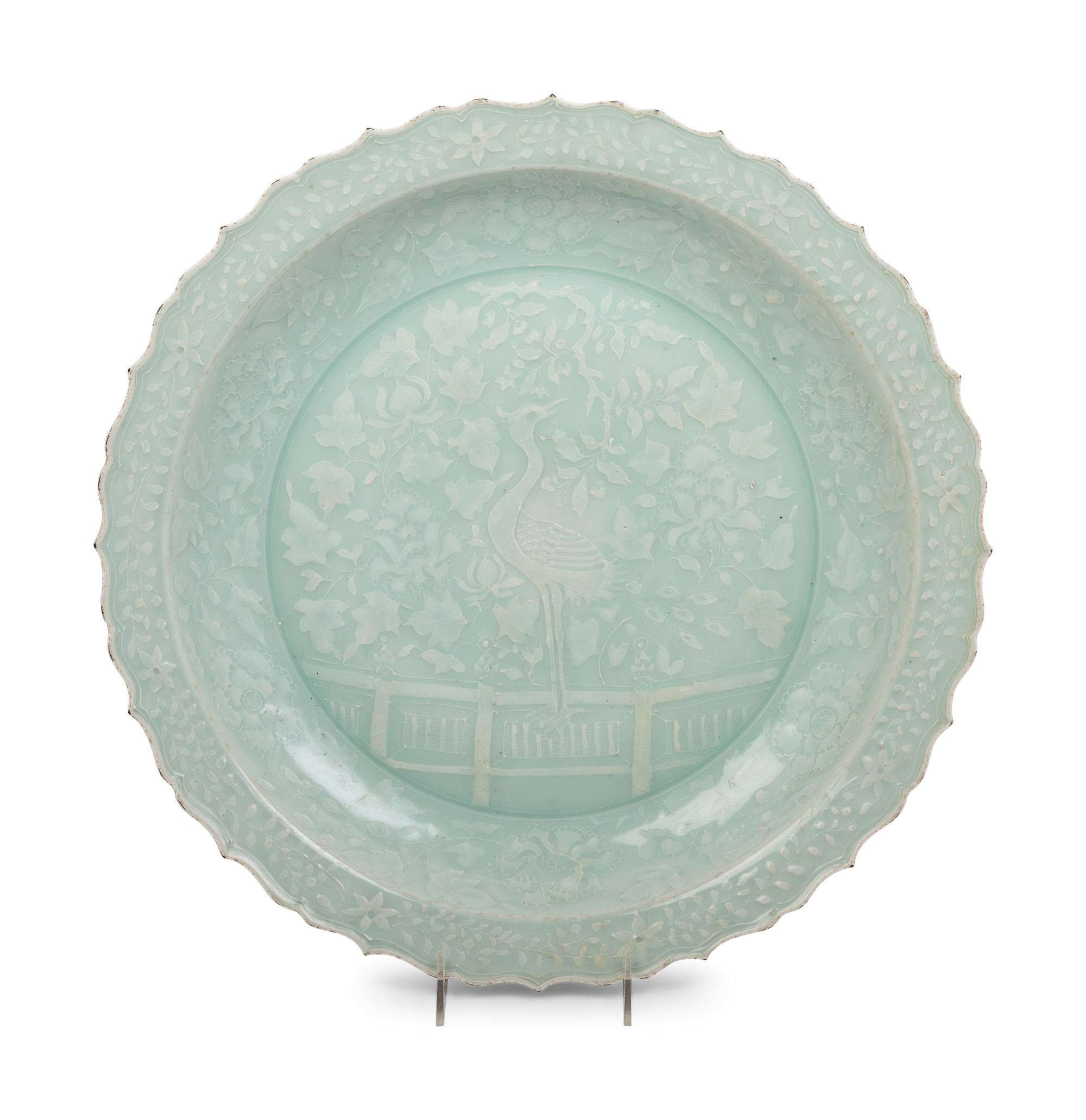 A Chinese Molded Celadon Glazed Porcelain Charger