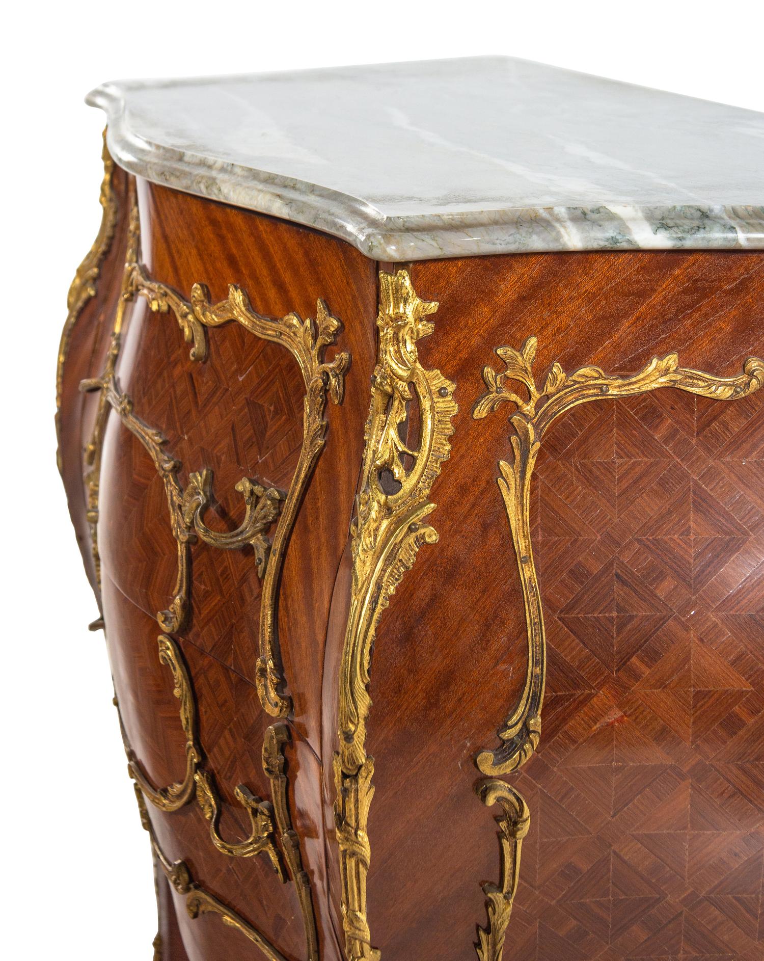 A Pair of Louis XV Style Gilt Bronze Mounted Marble-Top Bombe Commodes