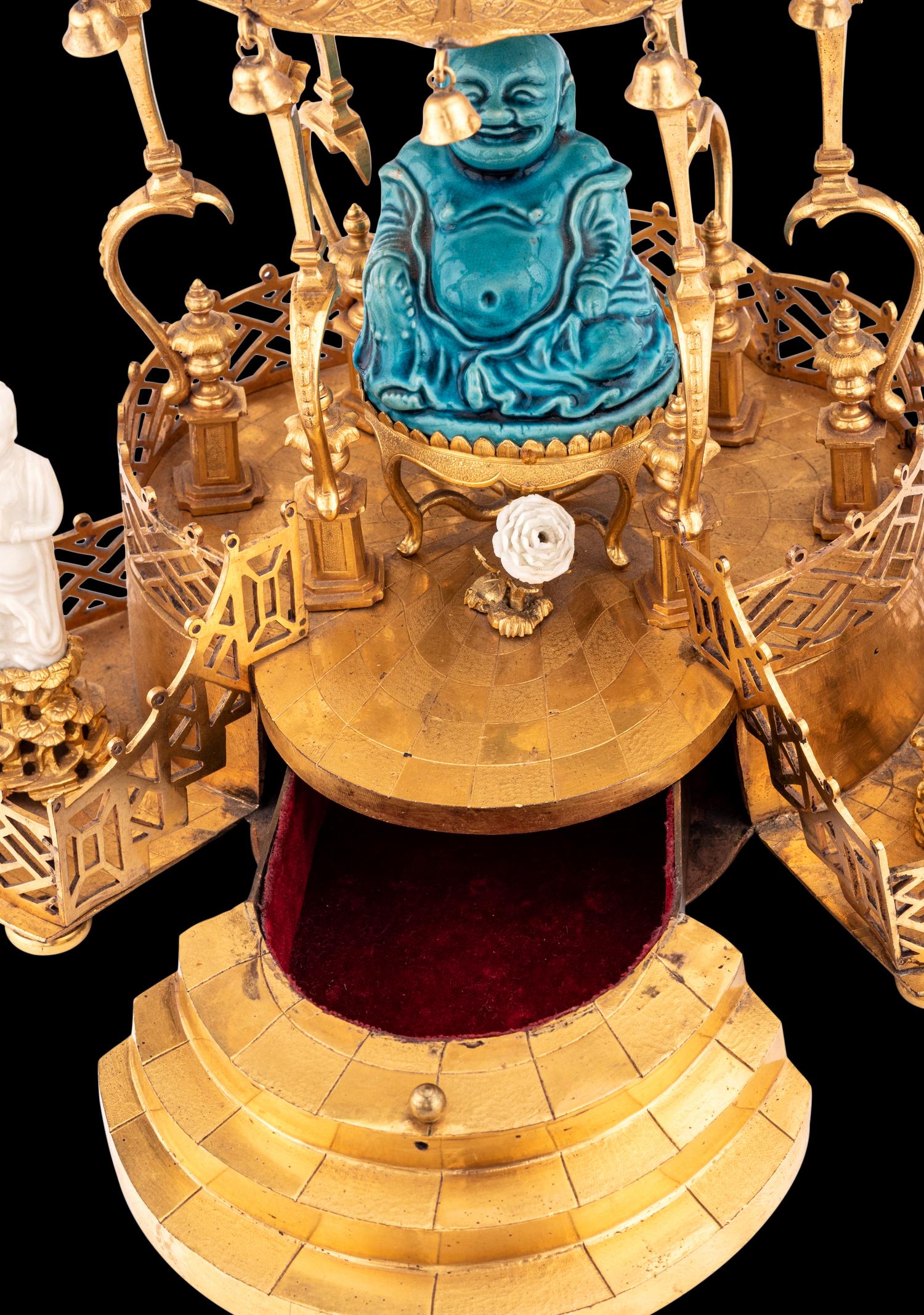 A Louis XV Style Gilt Bronze and Chinese Porcelain Mounted Pagoda-Form Mantel Clock