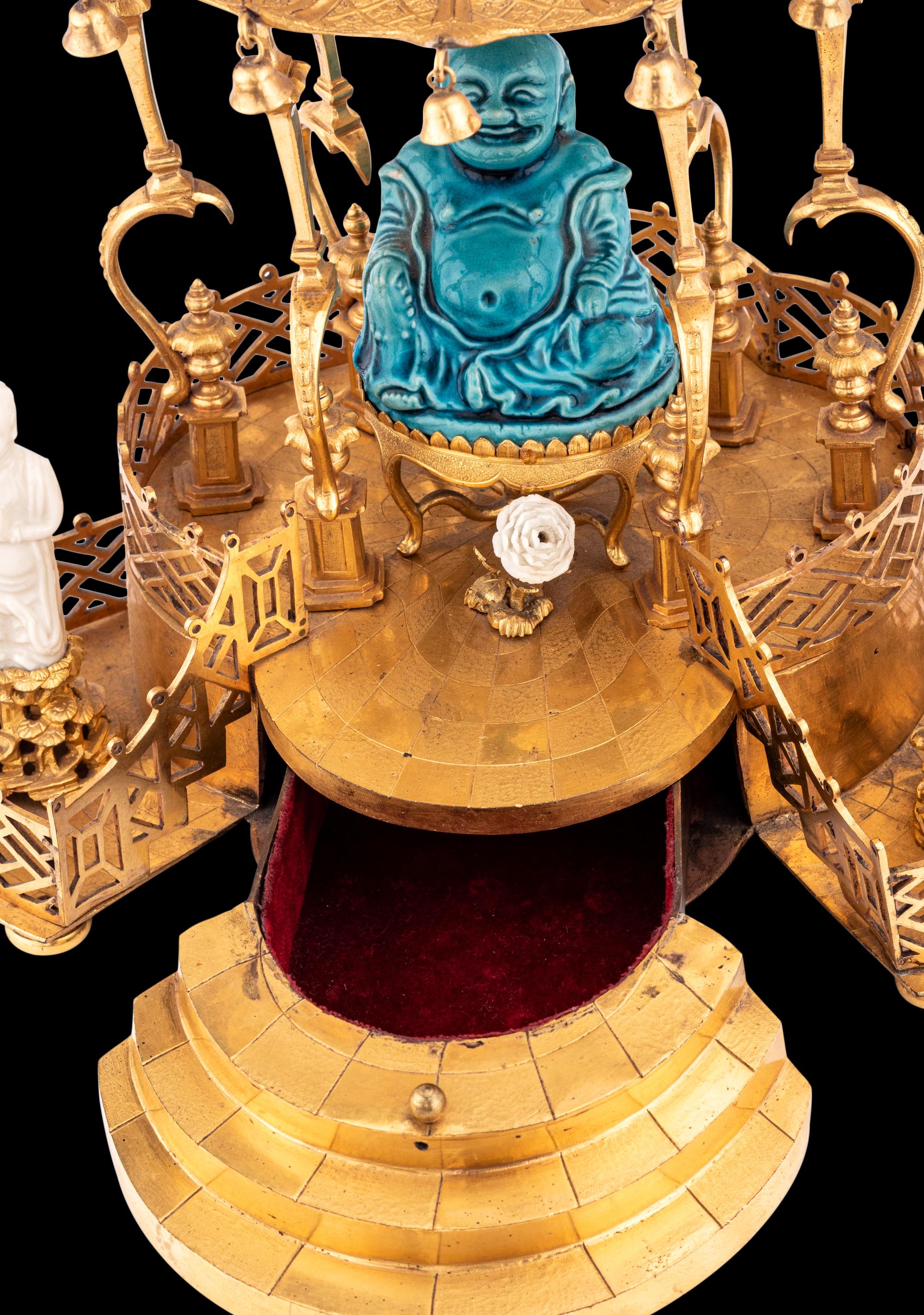 A Louis XV Style Gilt Bronze and Chinese Porcelain Mounted Pagoda-Form Mantel Clock