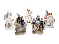 Four Staffordshire Glazed Figures and a Figural Watch Hutch