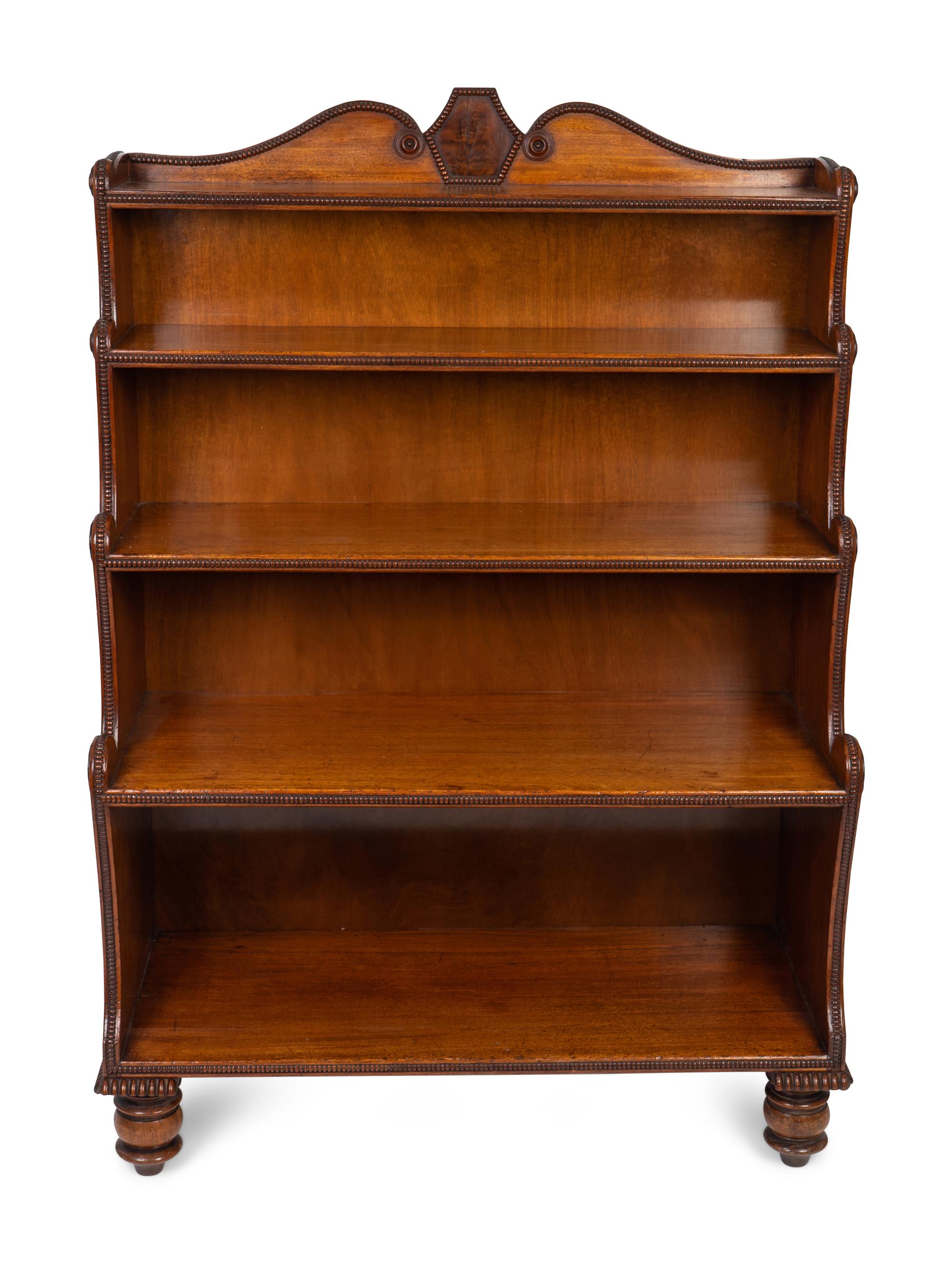 A George IV Carved Mahogany Waterfall Bookshelf In the Manner of Gillows — 19TH CENTURY
