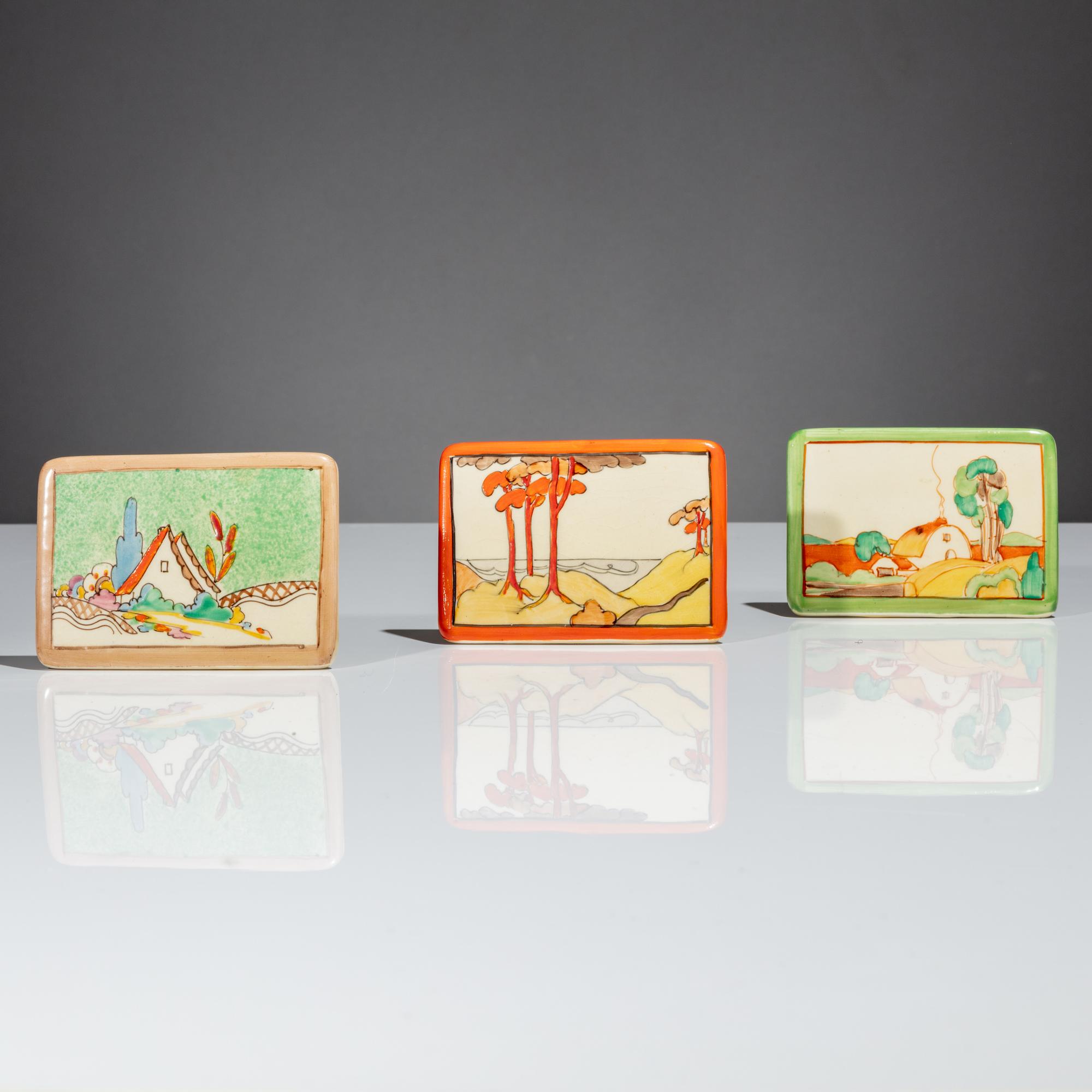Clarice Cliff (English, 1899–1972) — Three Advertising Plaques, Chalet, Coral Firs and Brookfields patterns