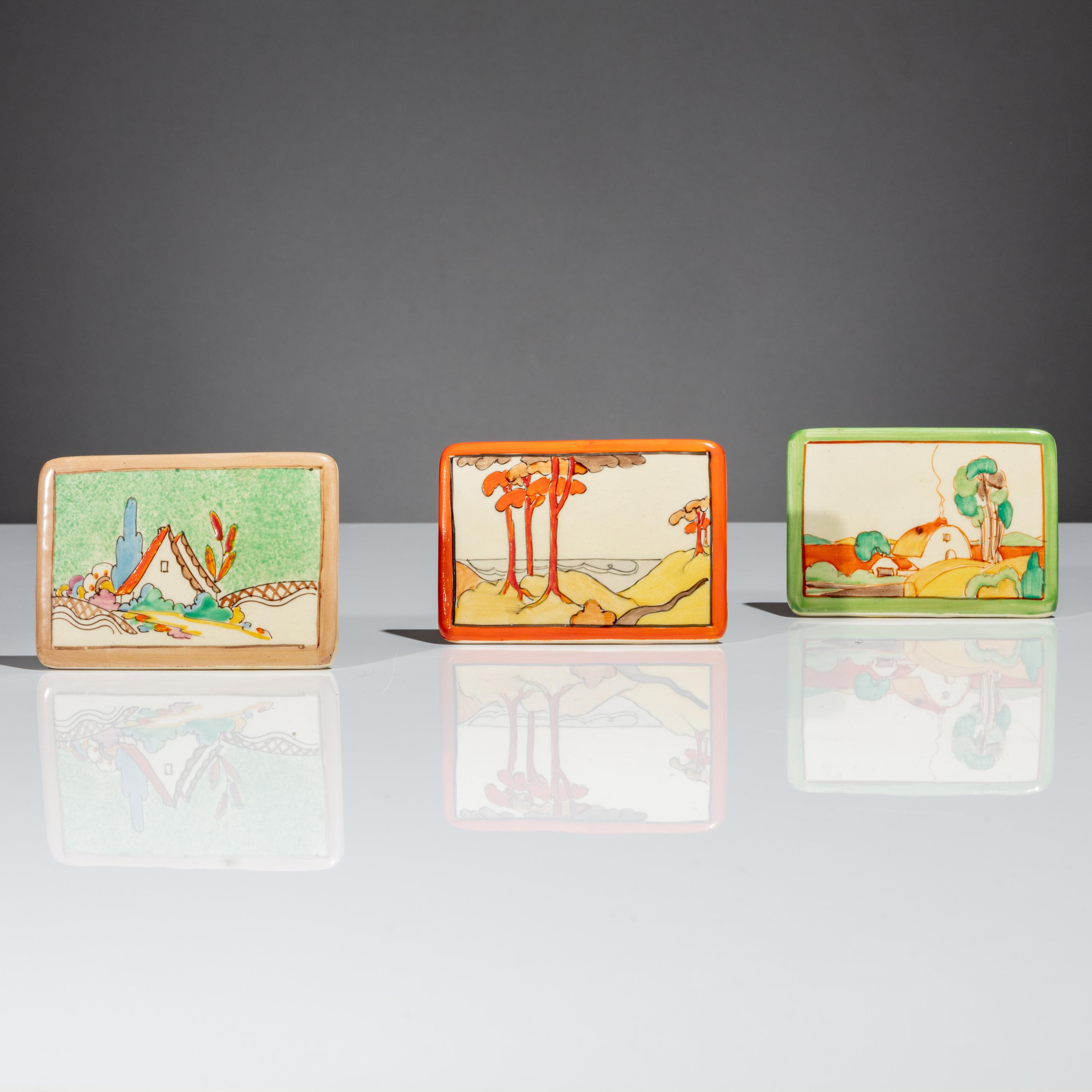 Clarice Cliff (English, 1899–1972) — Three Advertising Plaques, Chalet, Coral Firs and Brookfields patterns