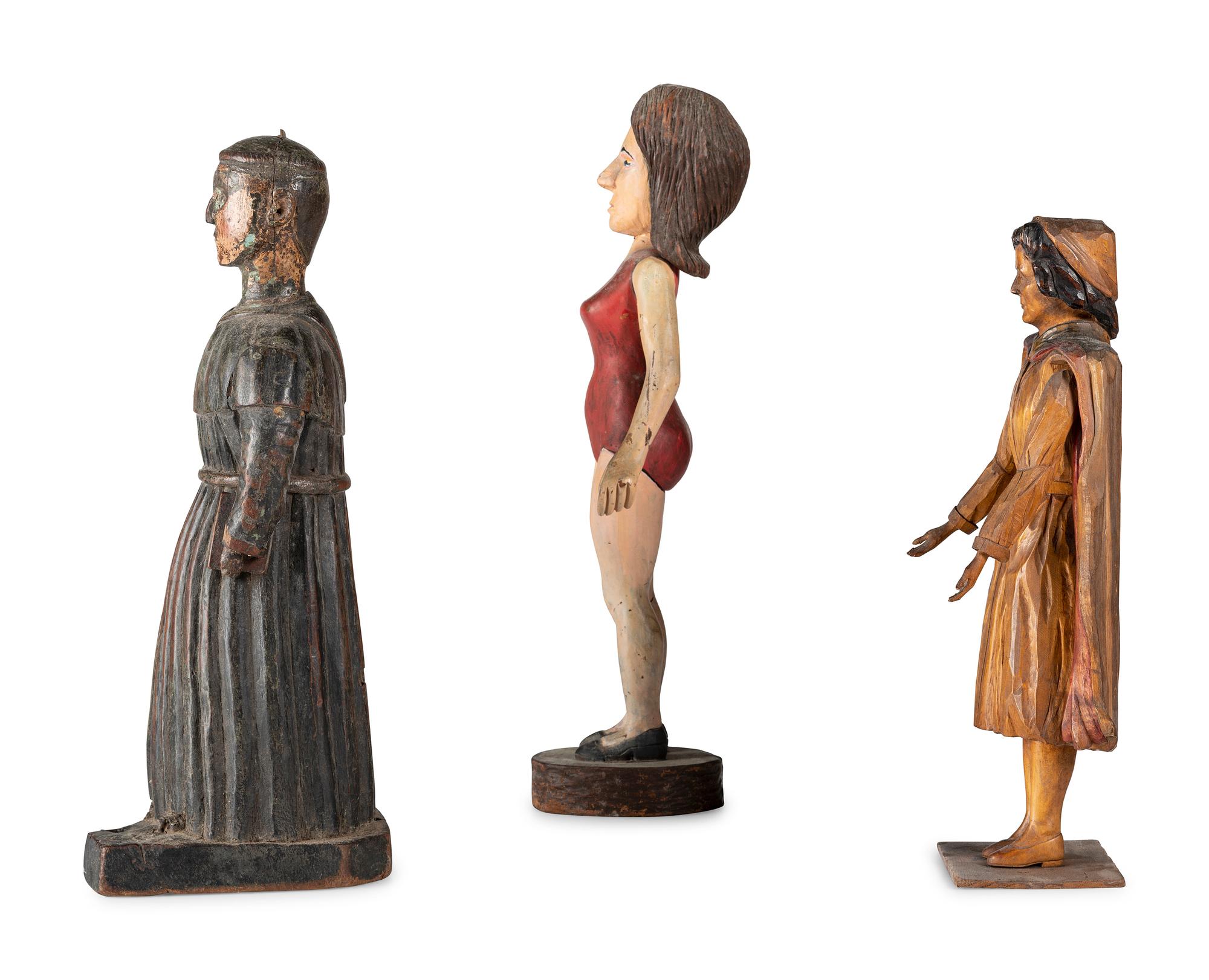 Three Carved and Painted Wooden Figures