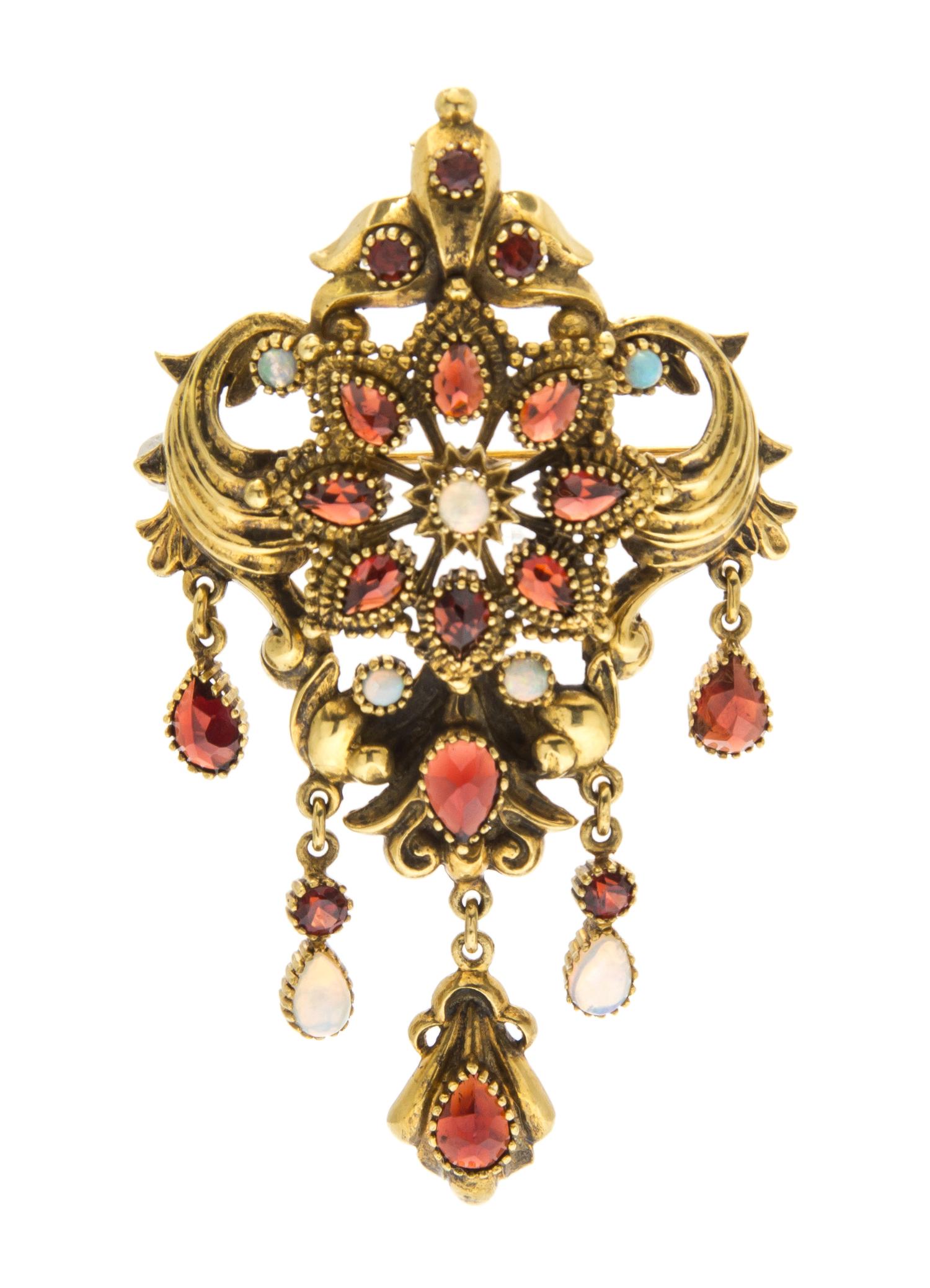 An 18 Karat Yellow Gold, Garnet and Opal Pendant/Brooch, 20.40 dwts.