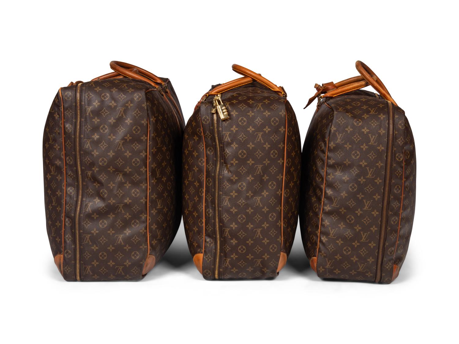 A Group of Three Louis Vuitton Soft-Sided Suitcases, 20th Century